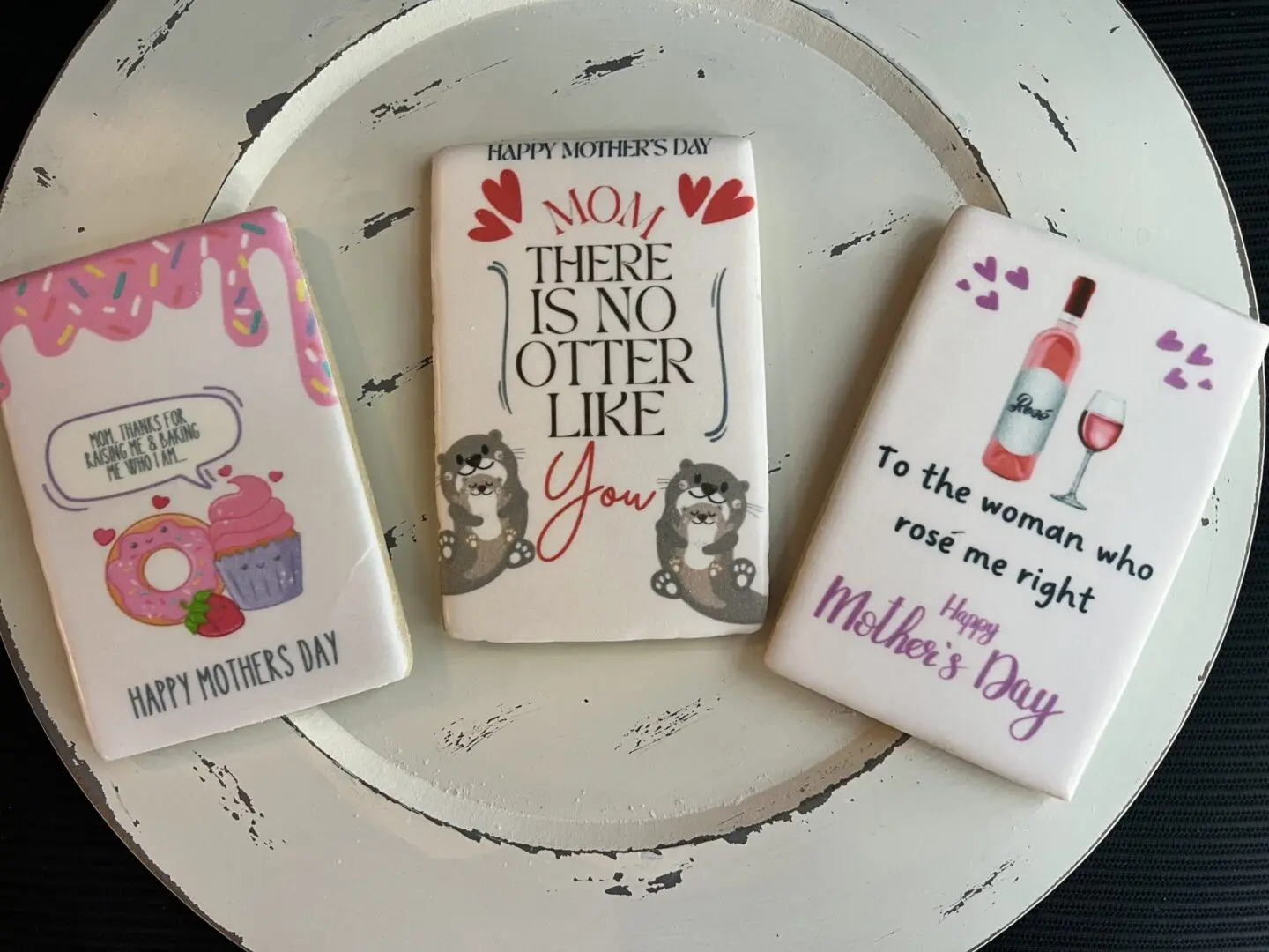 Mother's Day themed decorative cookies on plate.